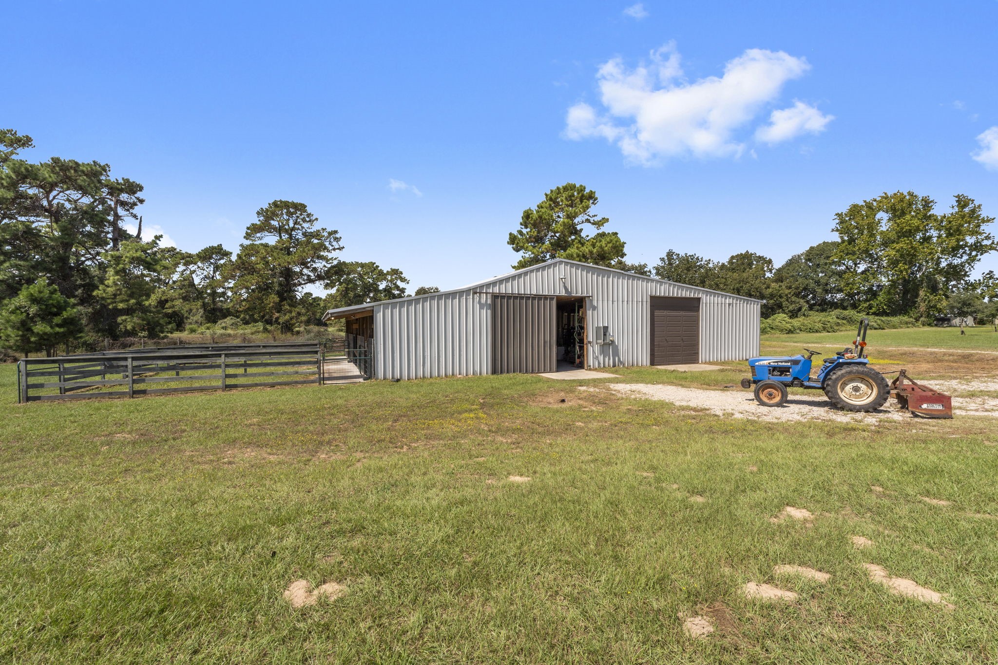 1534 Virgie Community Road Magnolia, TX 77354 - Photo 44 of 50 The 60'x50' workshop is truly a special building with a multitude of uses. all the electricity you need to go along with a half bath means you can work all day if desired. Don't forget to notice the 50 amp hookup! The left side of the exterior features two horse stalls with mats, automatic waterers and runs.