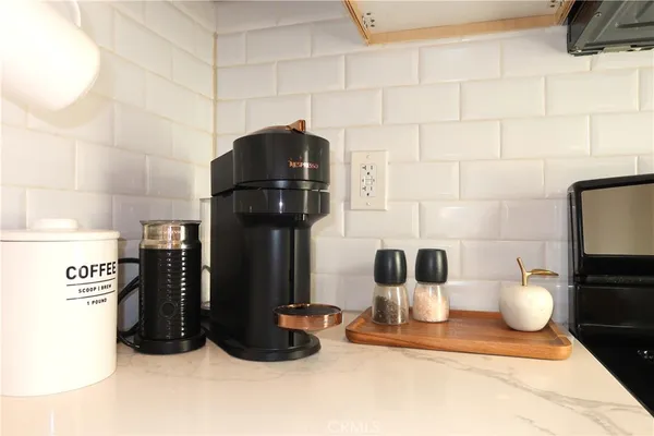 a kitchen with a sink and a refrigerator