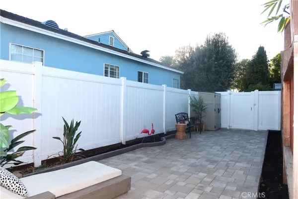 a view of backyard with potted plants