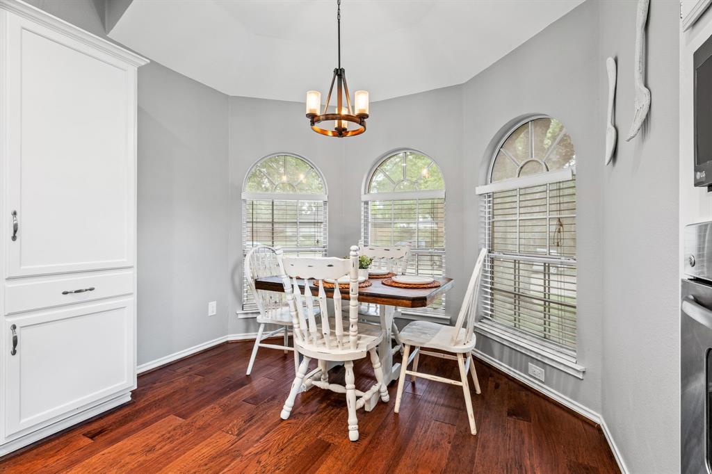 2302 Randi Road Rowlett, TX 75088 - Photo 13 of 33 a view of a dining room with furniture window and wooden floor