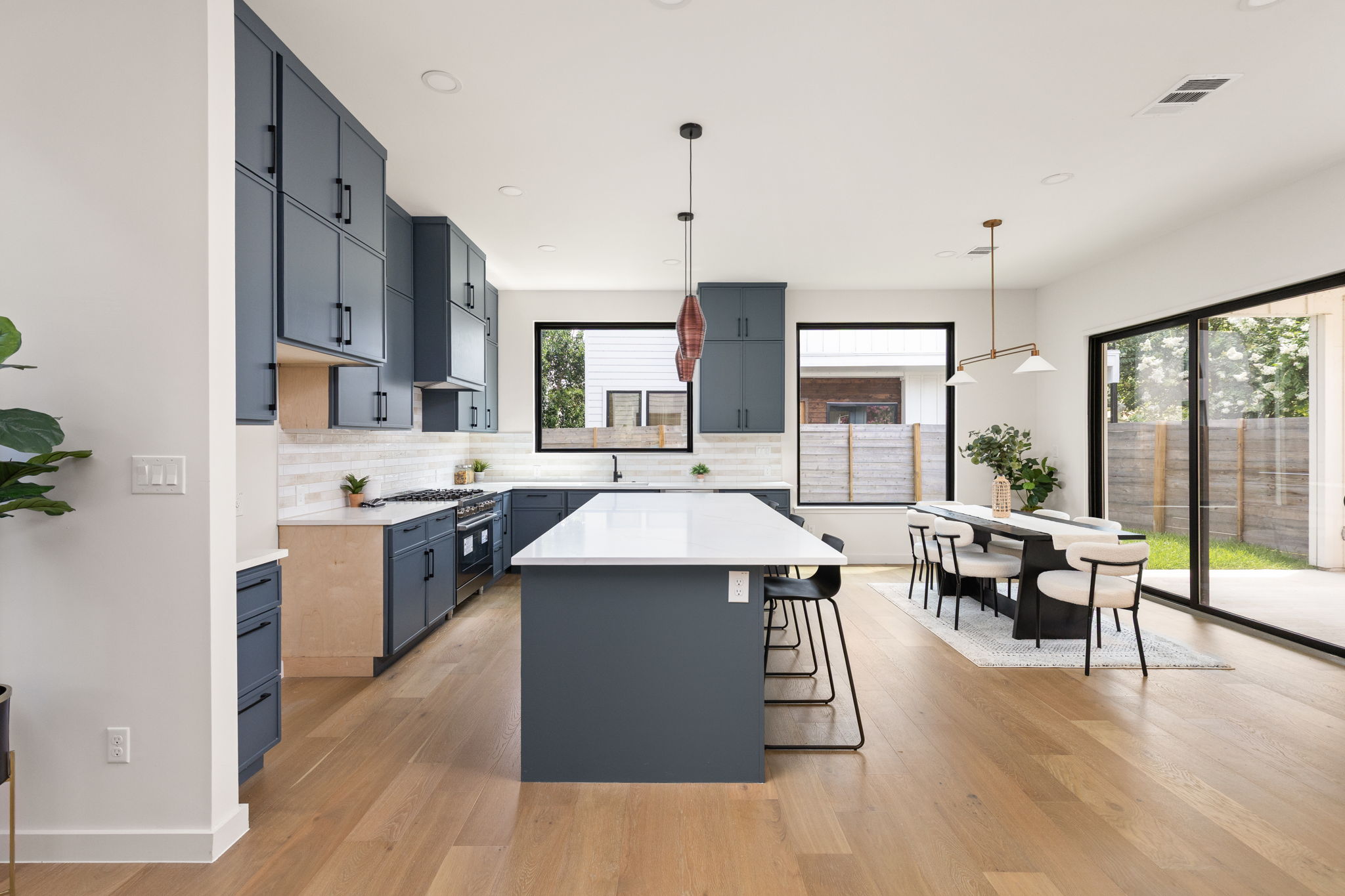 2717 Lyons Road, Unit 1 Austin, TX 78702 - Photo 5 of 40 Culinary delights await in this modern kitchen with extensive counter space and an adjoining dining area.