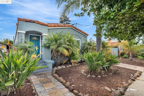 a plant is sitting in front of a house