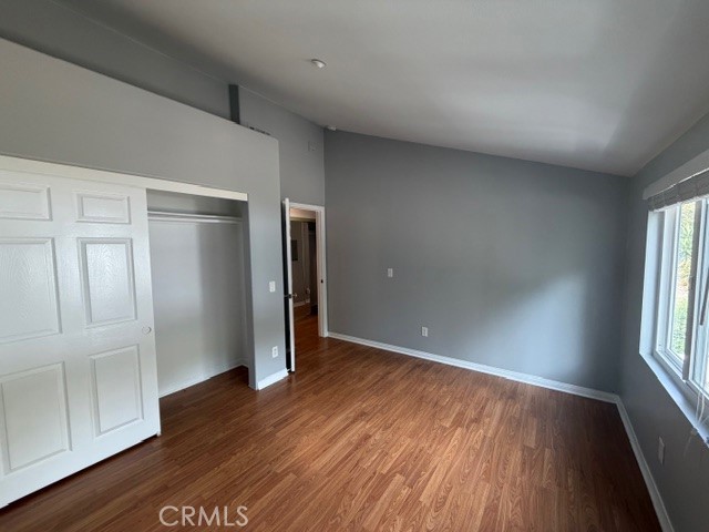 3709 Las Flores Canyon Road, Unit D Malibu, CA 90265 - Photo 20 of 33 an empty room with wooden floor and windows