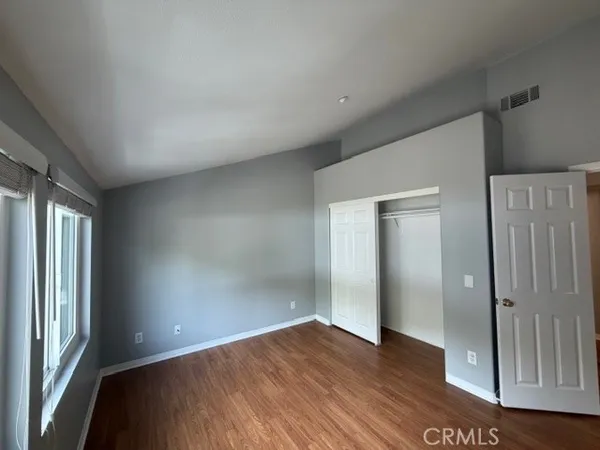 a view of hallway with wooden floor