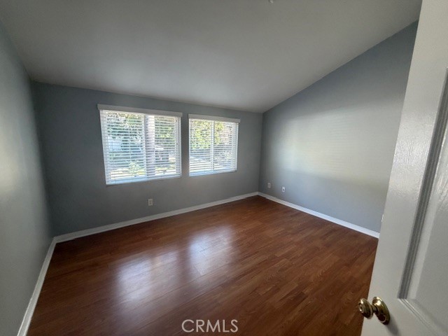 3709 Las Flores Canyon Road, Unit D Malibu, CA 90265 - Photo 23 of 33 an empty room with wooden floor and windows
