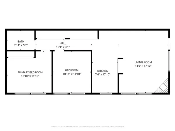 a front view of a house with a parking space