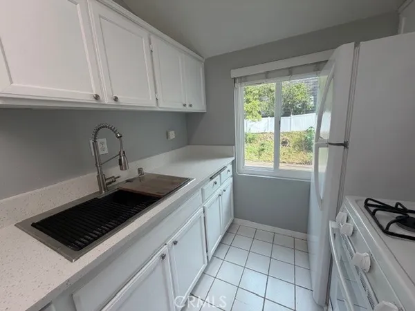a kitchen with a stove and a sink