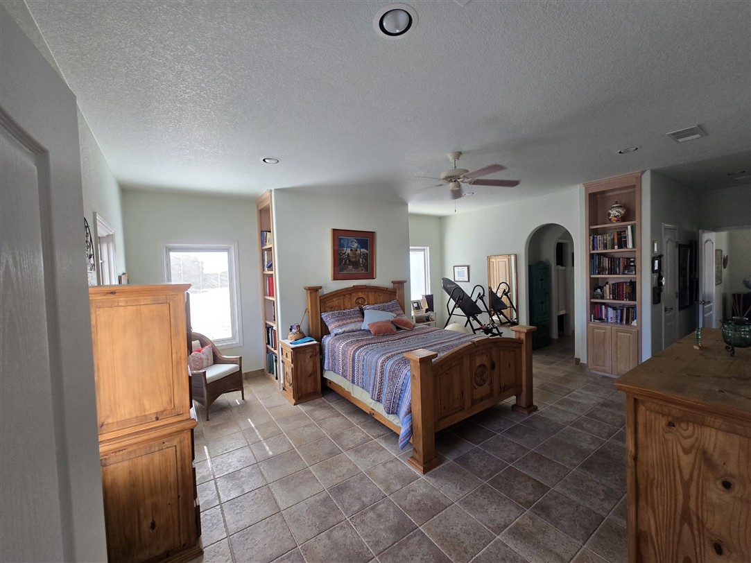 543 County Road 4620 Kempner, TX 76539 - Photo 13 of 36 a bed room with a bed and a refrigerator