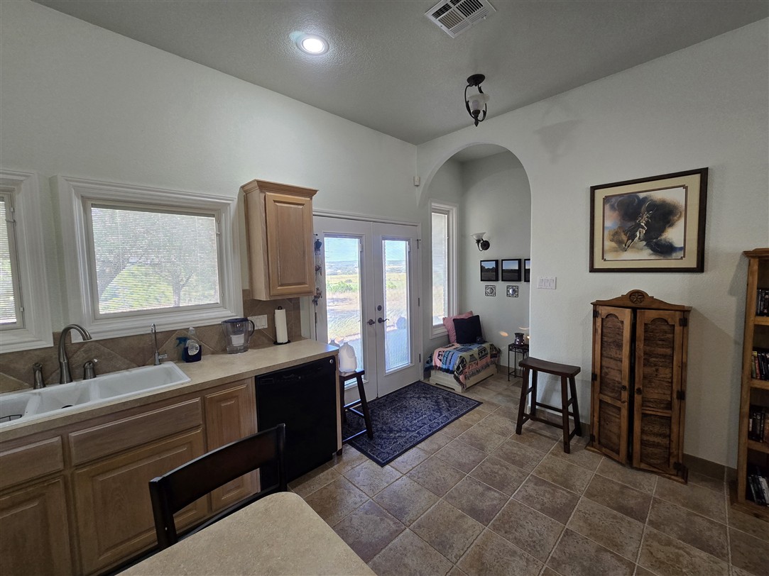 543 County Road 4620 Kempner, TX 76539 - Photo 18 of 36 a spacious bathroom with a double vanity sink a mirror and a bathtub