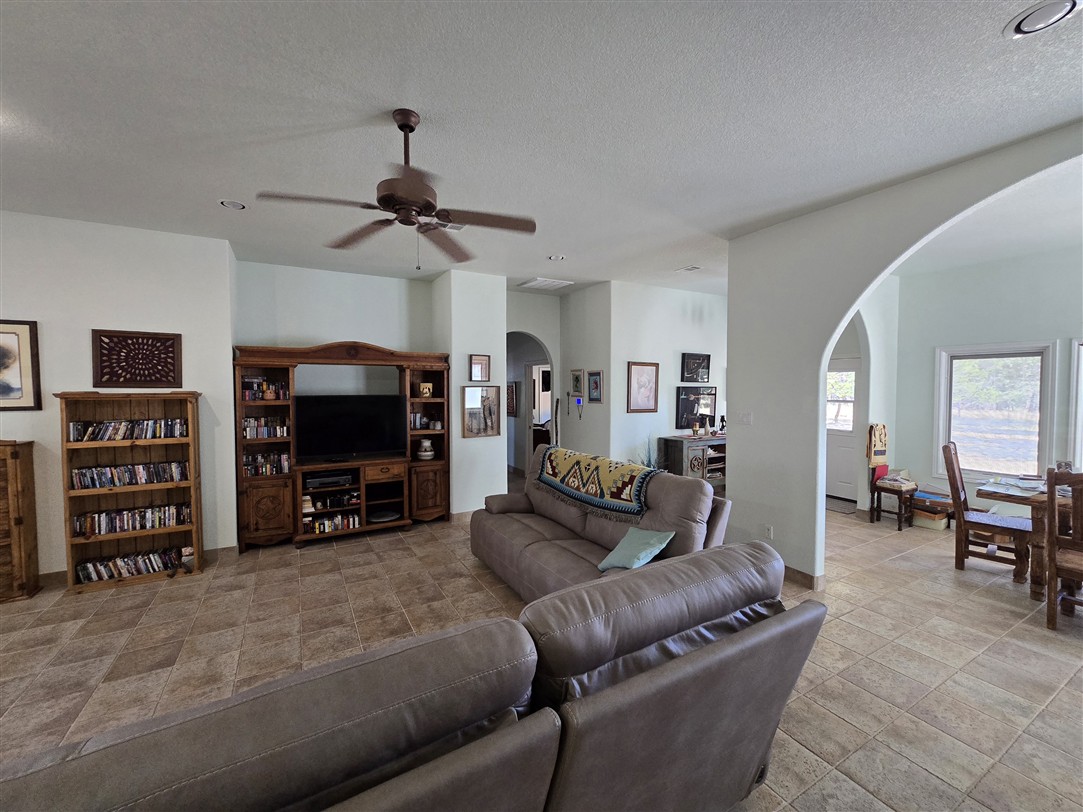 543 County Road 4620 Kempner, TX 76539 - Photo 20 of 36 a living room with furniture a flat screen tv and a fireplace