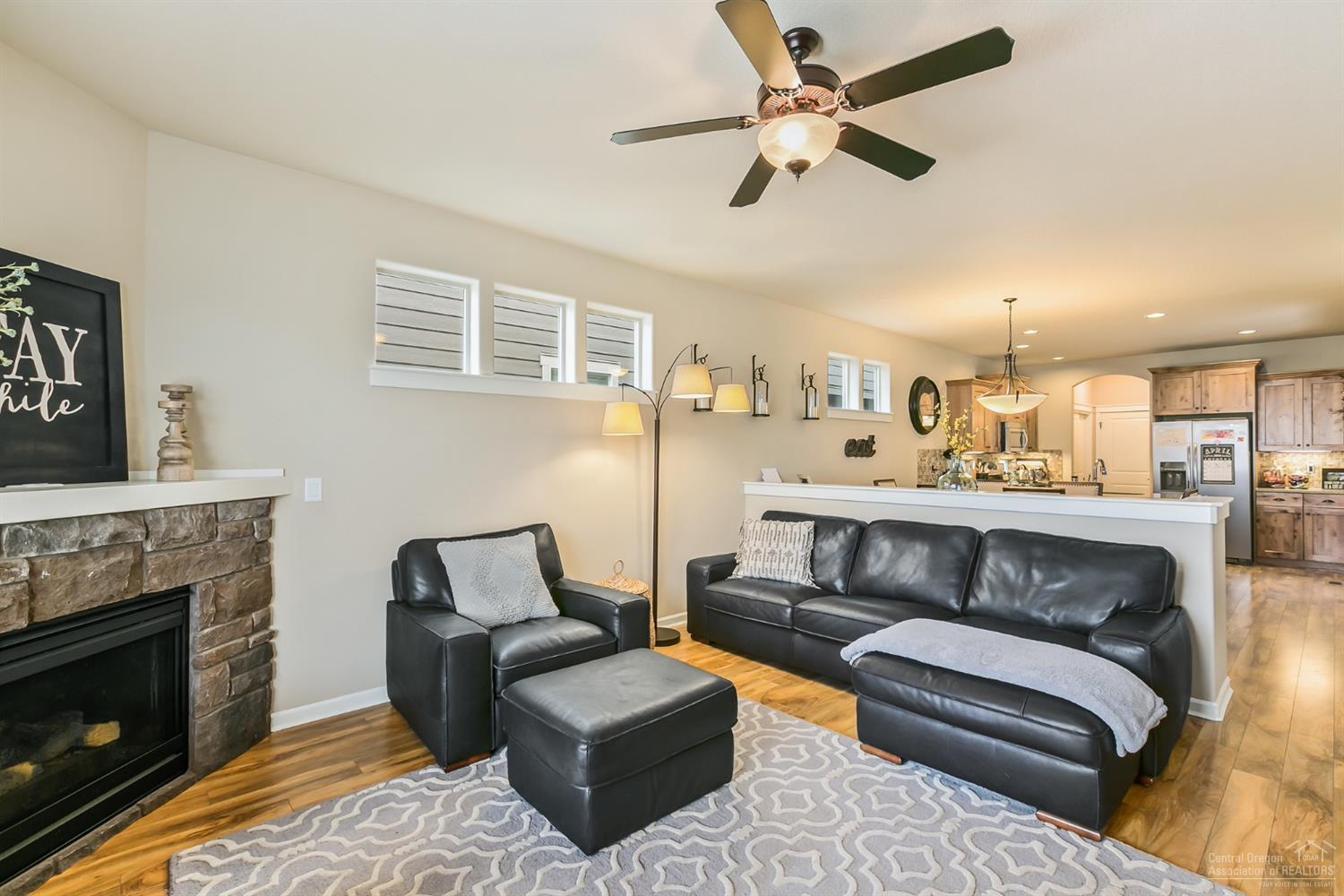 Great room has gas fireplace with stone
