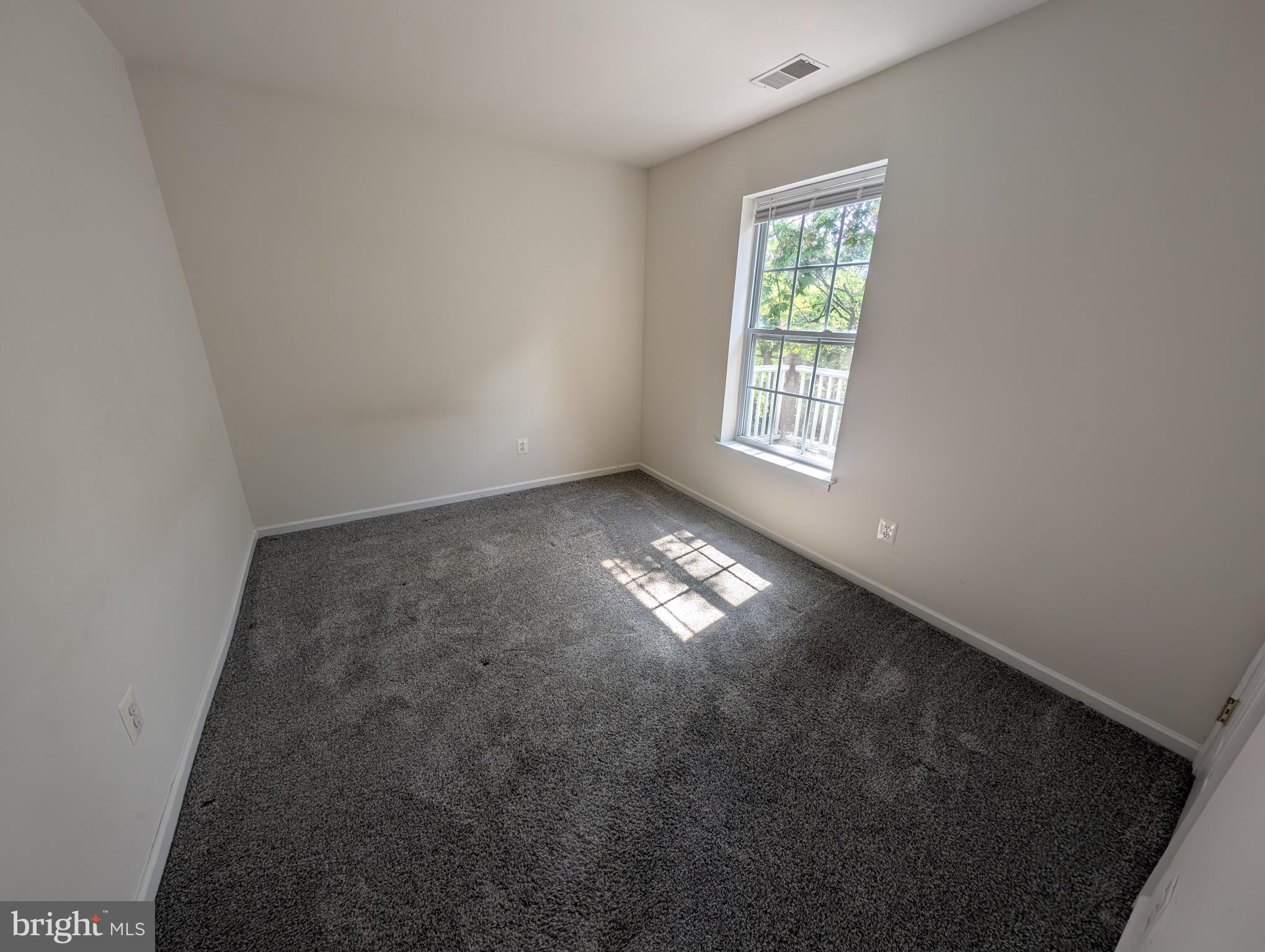 204 River Birch Circle, Unit 204 Kennett Square, PA 19348 - Photo 12 of 24 an empty room with windows