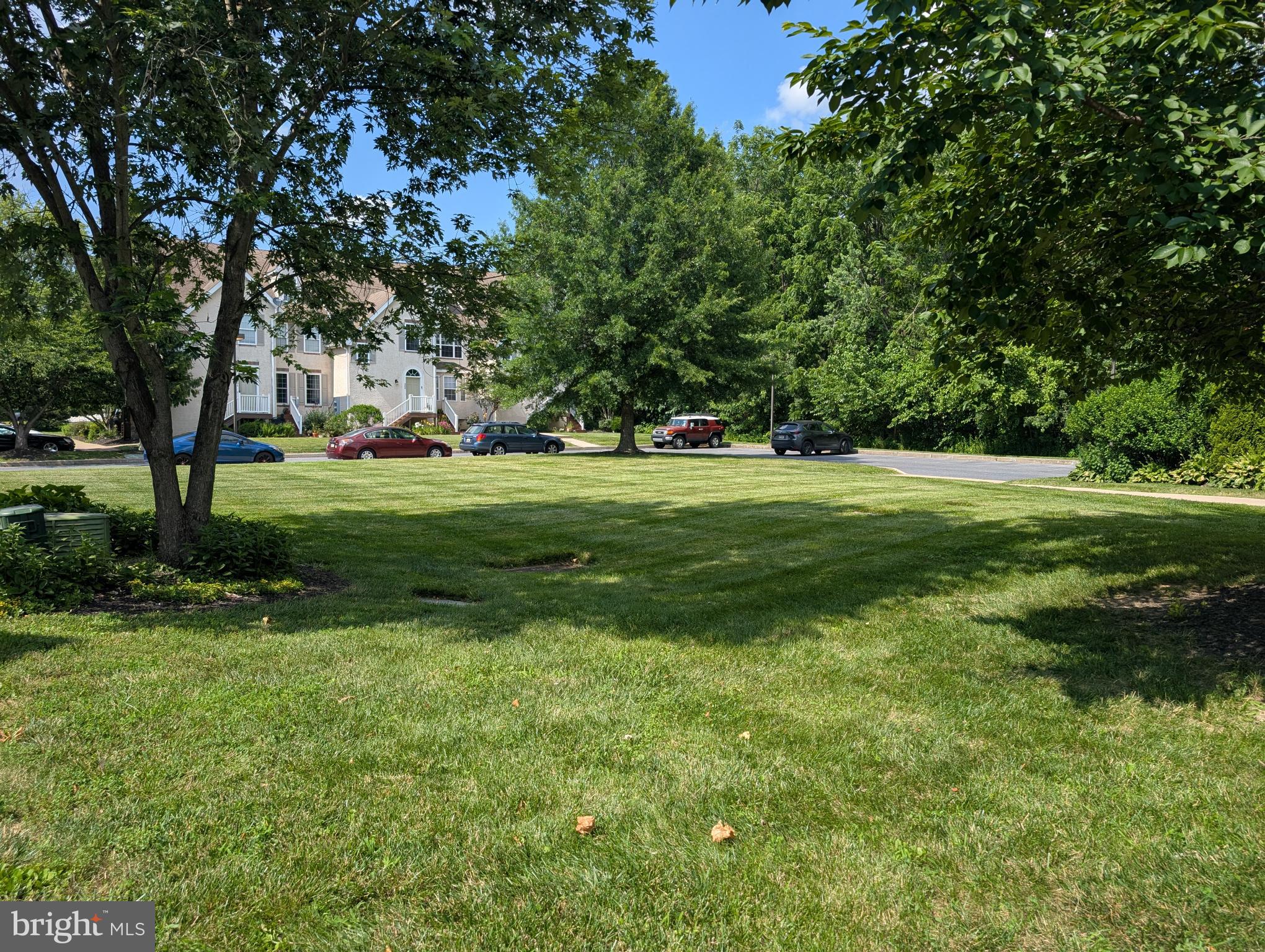 204 River Birch Circle, Unit 204 Kennett Square, PA 19348 - Photo 21 of 24 a big yard with lots of green space and trees