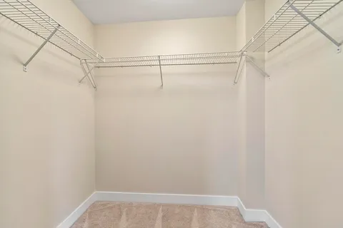 a view of an empty walk in closet