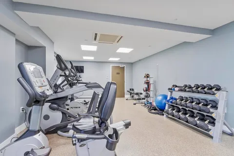 a view of a room with gym equipment