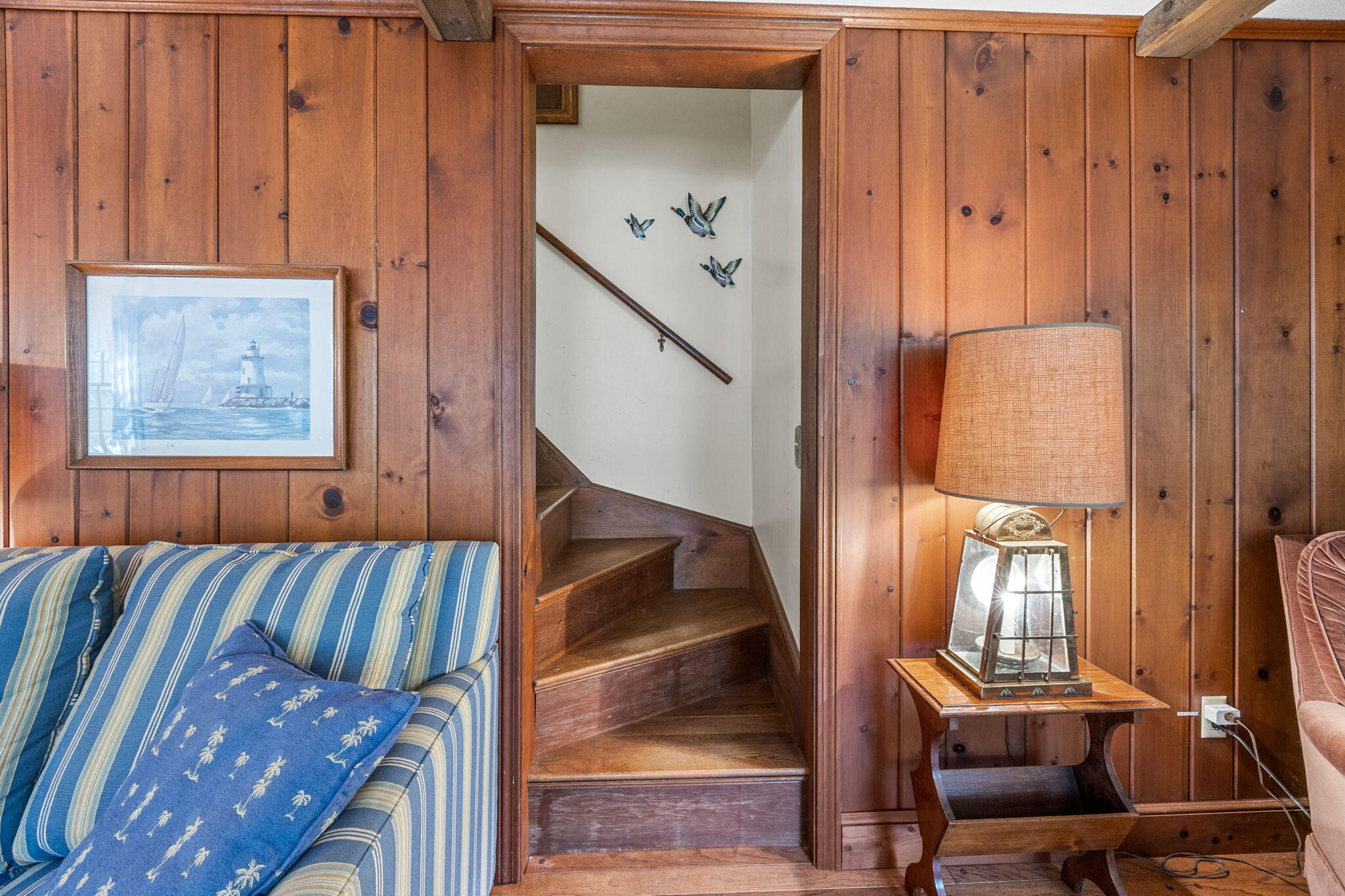 65 Cestaro Way Eastham, MA 02642 - Photo 11 of 37 a view of a hallway with wooden floor and stairs