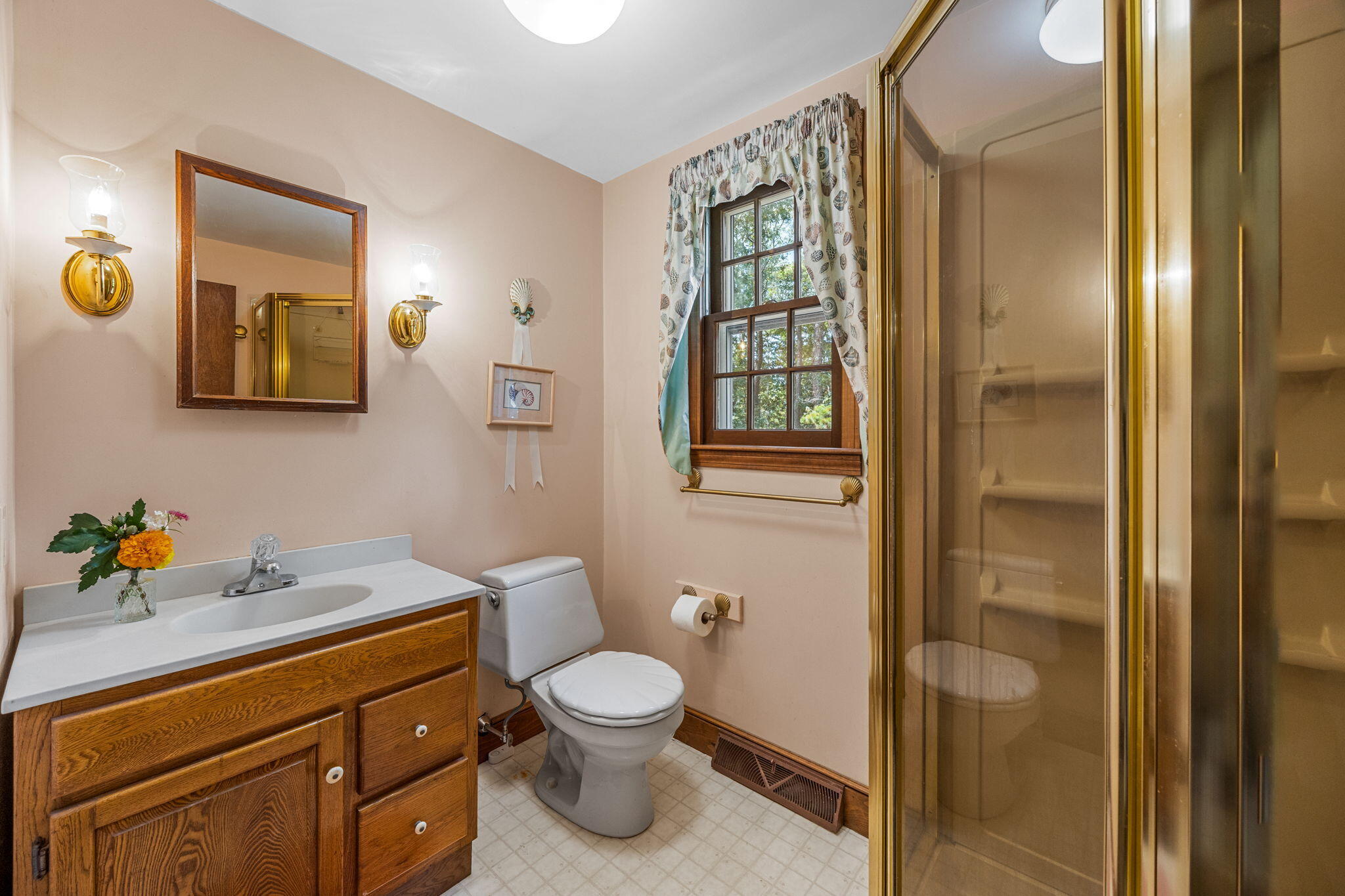 65 Cestaro Way Eastham, MA 02642 - Photo 16 of 37 a bathroom with a toilet sink and mirror
