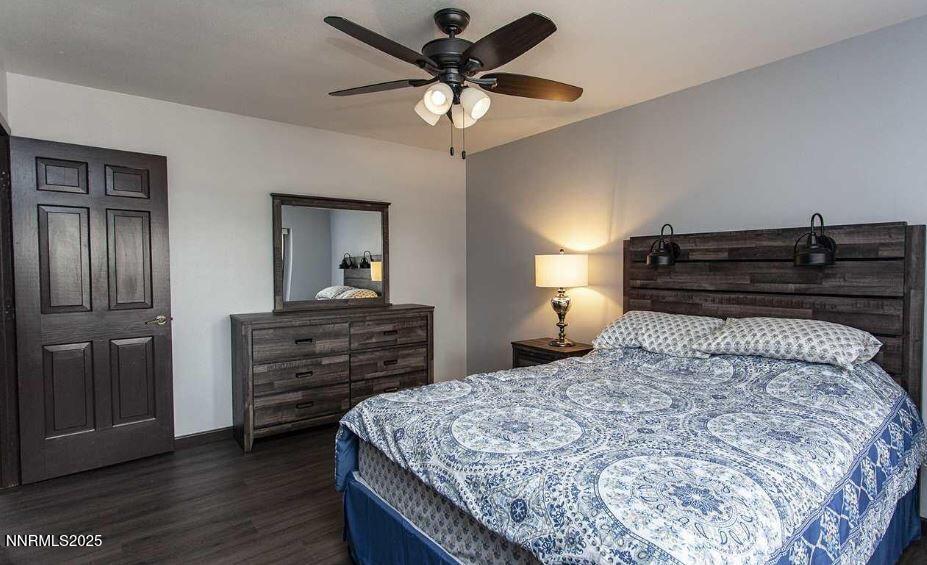 7050 Pembroke Drive Reno, NV 89502 - Photo 20 of 32 a bedroom with a bed and a dresser