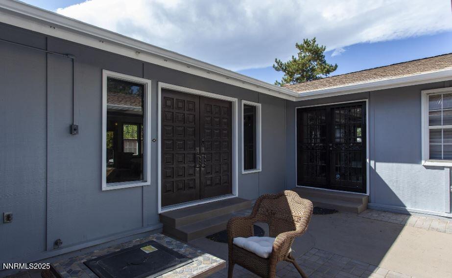 7050 Pembroke Drive Reno, NV 89502 - Photo 24 of 32 a living room with furniture and a potted plant