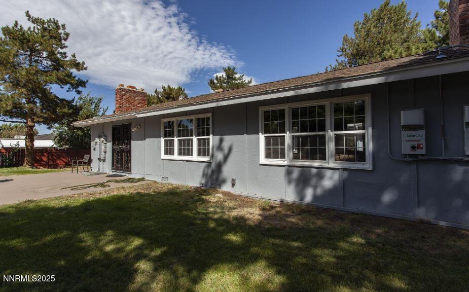 7050 Pembroke Drive Reno, NV 89502 - Photo 26 of 32 a front view of a house with a garden