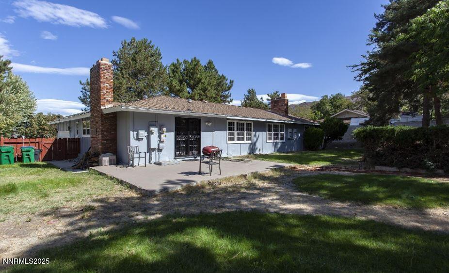 7050 Pembroke Drive Reno, NV 89502 - Photo 28 of 32 a view of a house with backyard and sitting area