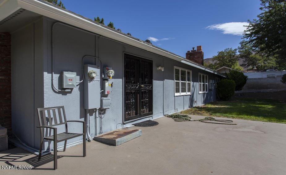 7050 Pembroke Drive Reno, NV 89502 - Photo 29 of 32 a view of a house with backyard and porch