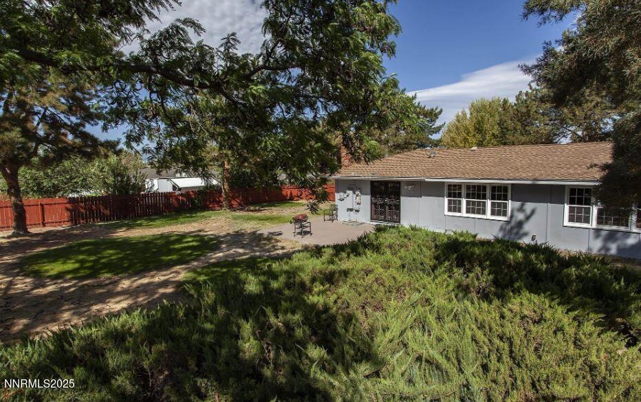 7050 Pembroke Drive Reno, NV 89502 - Photo 30 of 32 a aerial view of a house with a yard
