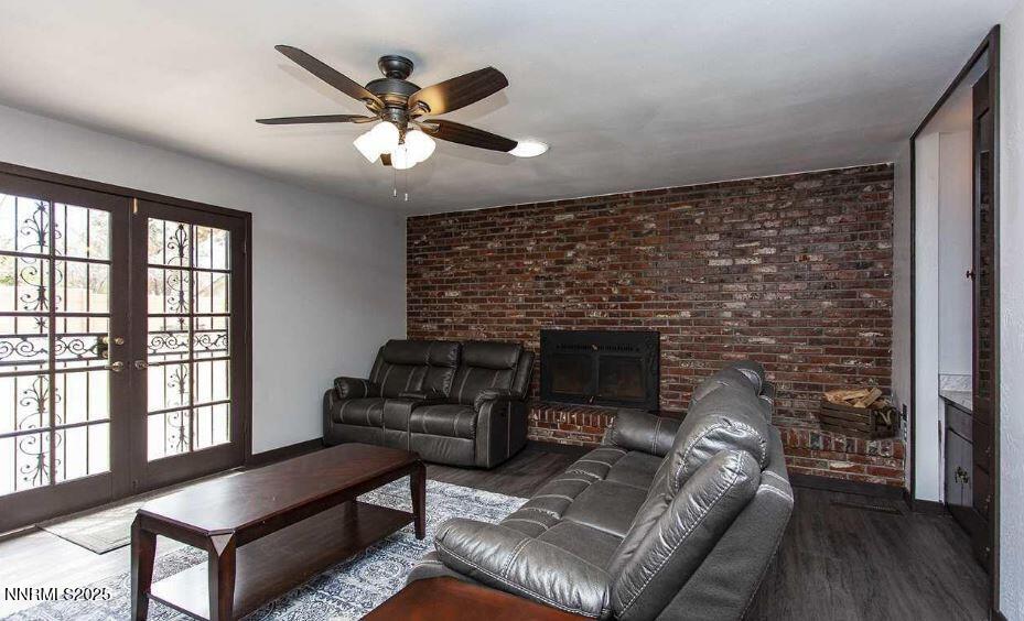 7050 Pembroke Drive Reno, NV 89502 - Photo 8 of 32 a living room with furniture and a fireplace