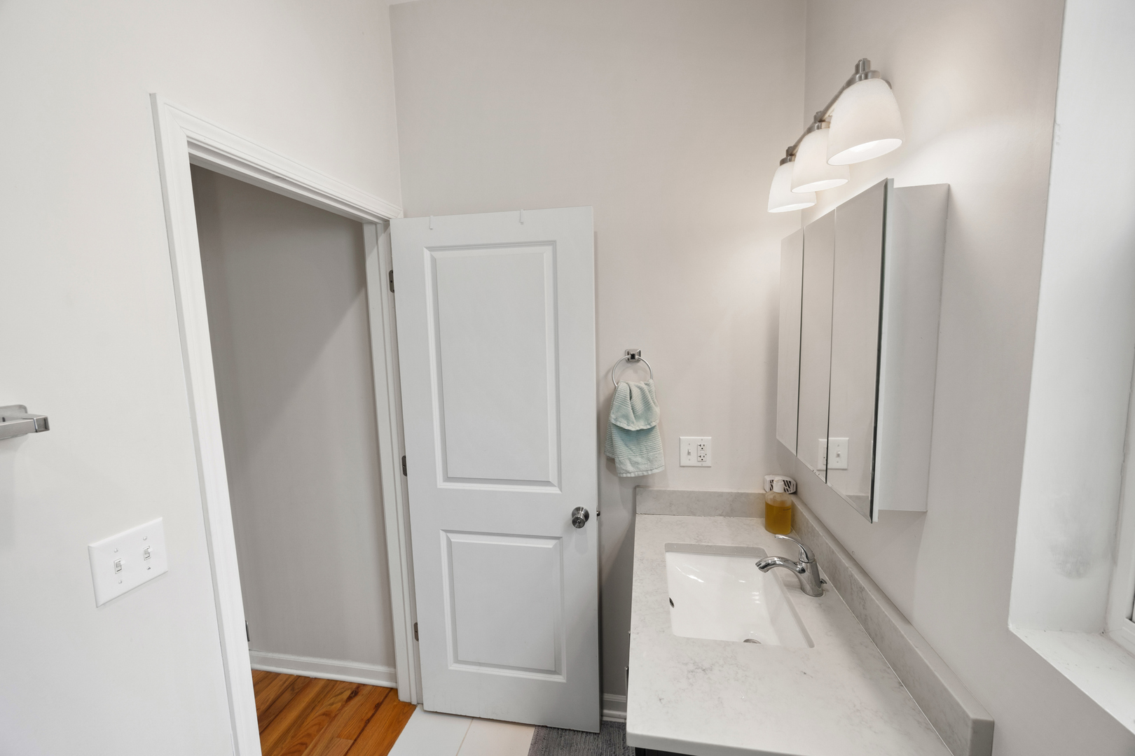 6418 South Rhodes Avenue Chicago, IL 60637 - Photo 11 of 19 a bathroom with a sink and a mirror