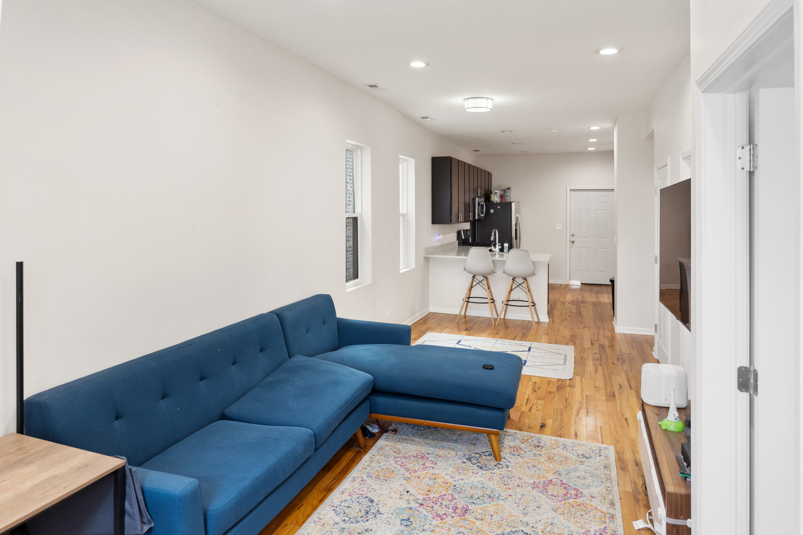 6418 South Rhodes Avenue Chicago, IL 60637 - Photo 4 of 19 a living room with furniture and a view of kitchen