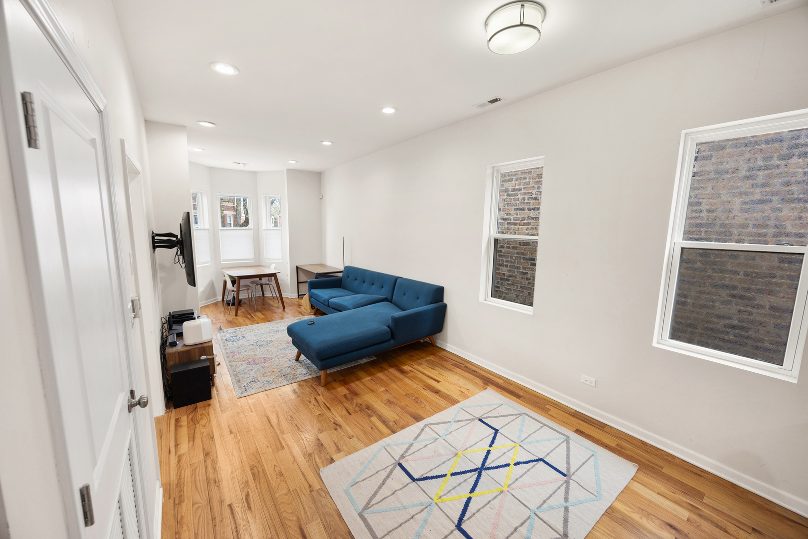 6418 South Rhodes Avenue Chicago, IL 60637 - Photo 5 of 19 a living room with furniture window and a wooden floor