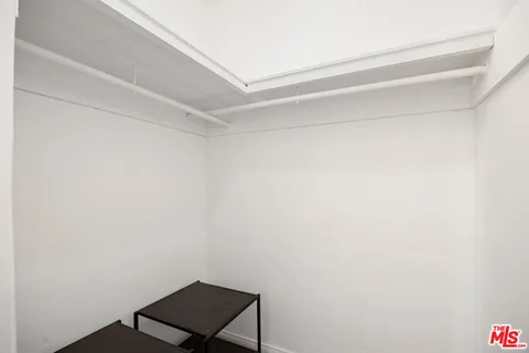 a view of a small space with racks on the wall