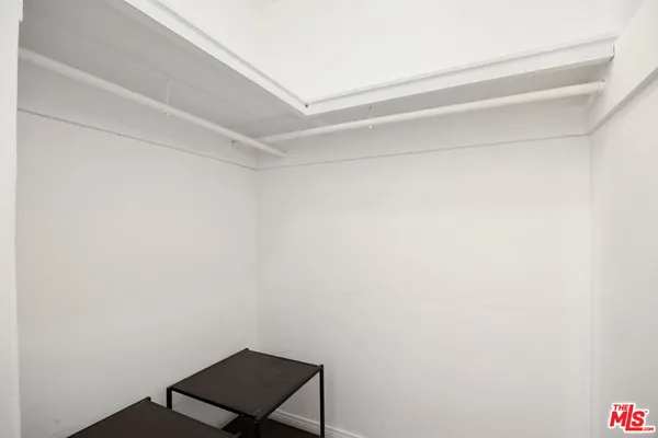 a view of a small space with racks on the wall