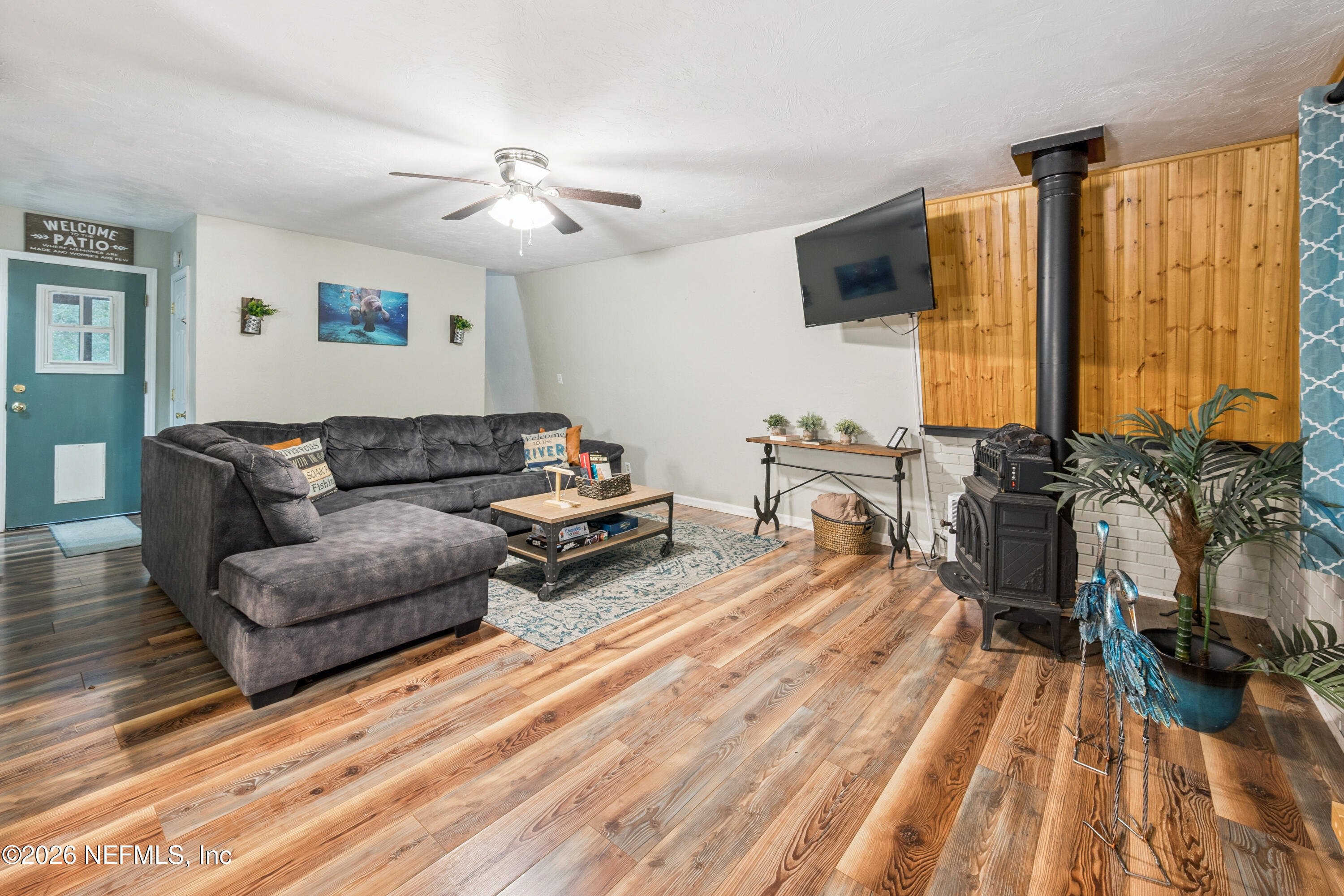 141 Southwest Longhorn Terrace Fort White, FL 32038 - Photo 5 of 31 a living room with furniture and a flat screen tv