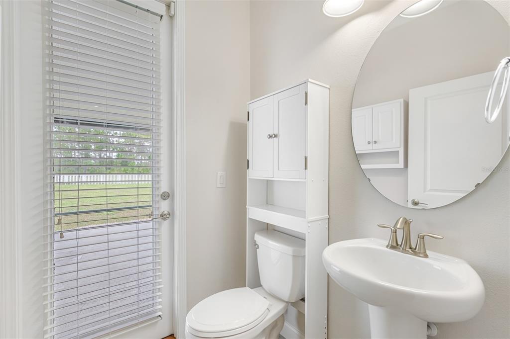13333 Orca Sound Drive Riverview, FL 33579 - Photo 11 of 32 a bathroom with a sink toilet and mirror