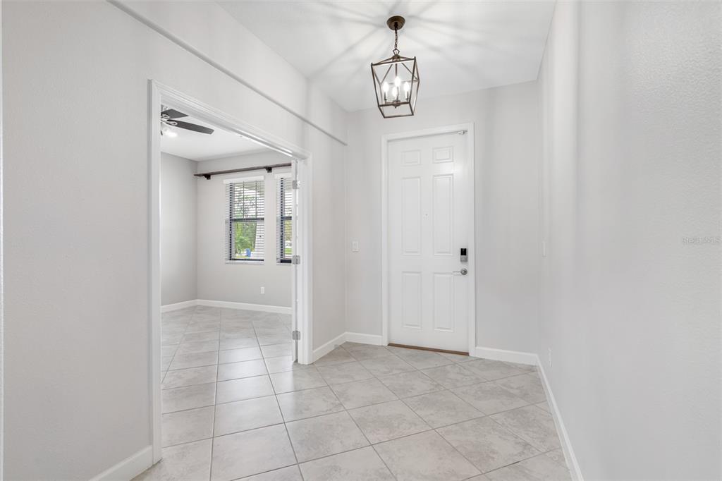 13333 Orca Sound Drive Riverview, FL 33579 - Photo 4 of 32 a view of a hallway with front door