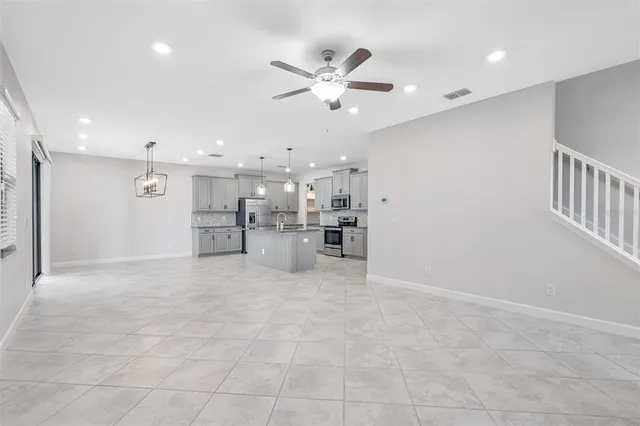 a view of a kitchen with a sink and cabinet