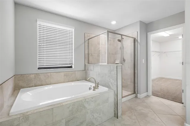 a bathroom with a granite countertop sink mirror vanity and toilet