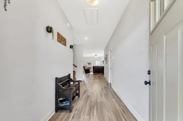 a view of a living room with wooden floor
