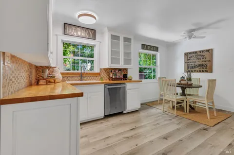 a kitchen with a sink cabinets and window