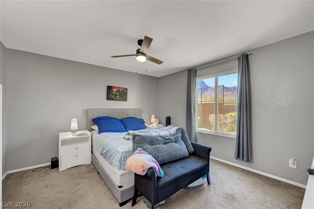 1285 Raritan Place Henderson, NV 89002 - Photo 15 of 20 Carpeted flooring paired with a large window highlights this restful space.