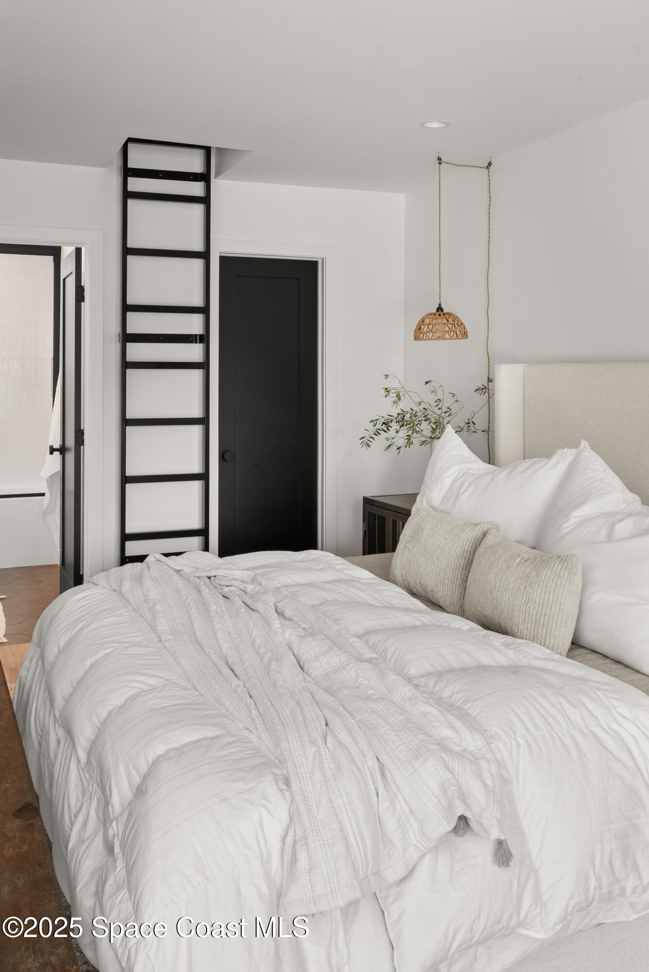 3425 Kent Drive Melbourne, FL 32935 - Photo 15 of 21 a bedroom with a bed and cabinets