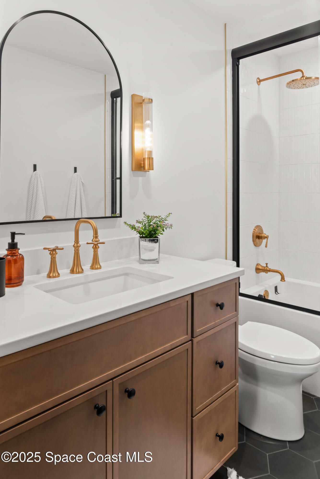 3425 Kent Drive Melbourne, FL 32935 - Photo 16 of 21 a bathroom with a sink and a mirror