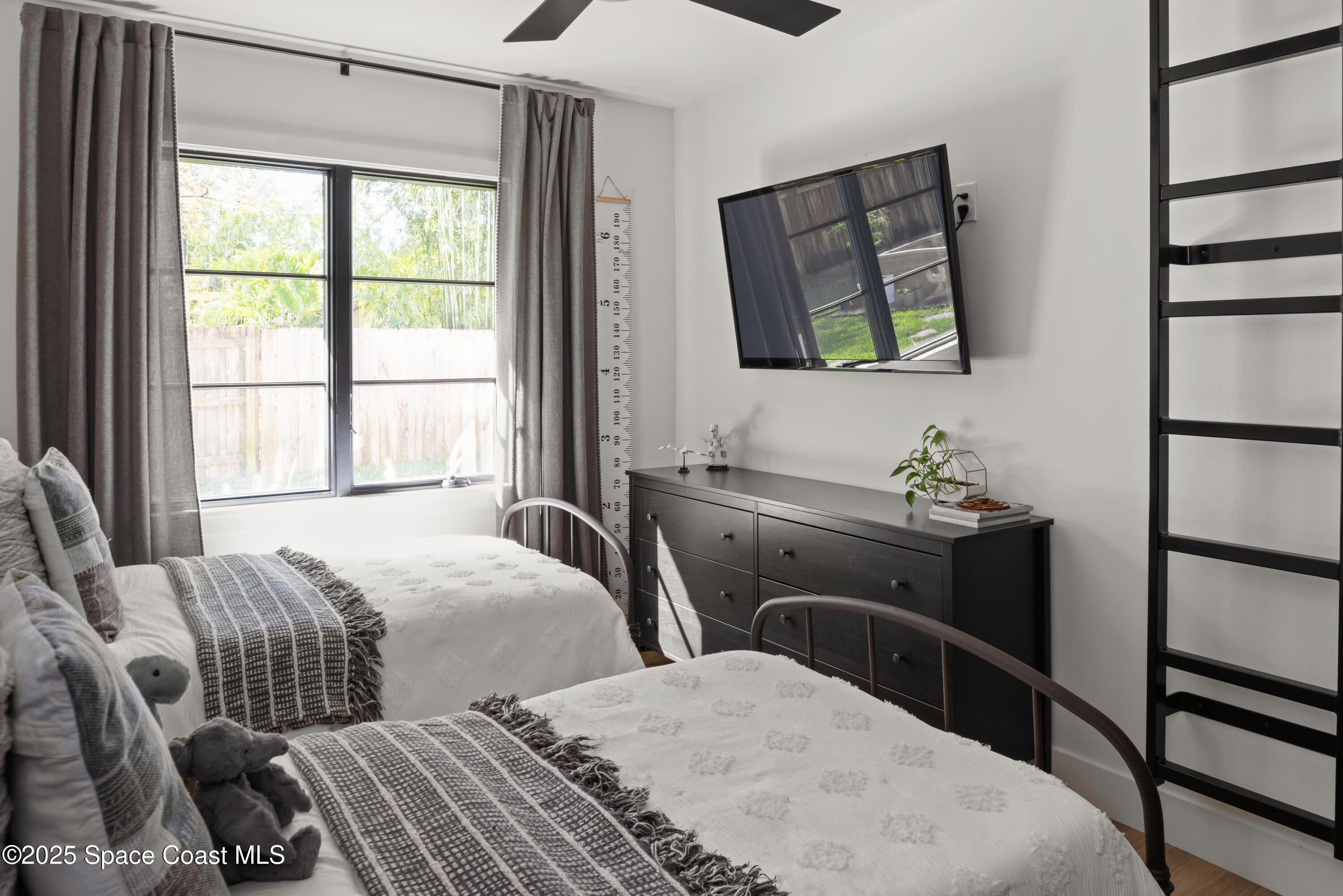 3425 Kent Drive Melbourne, FL 32935 - Photo 18 of 21 a bedroom with two beds and a window