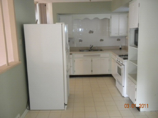 359 Phyllis Avenue Rochelle, IL 61068 - Photo 2 of 11 a kitchen with white cabinets and white appliances