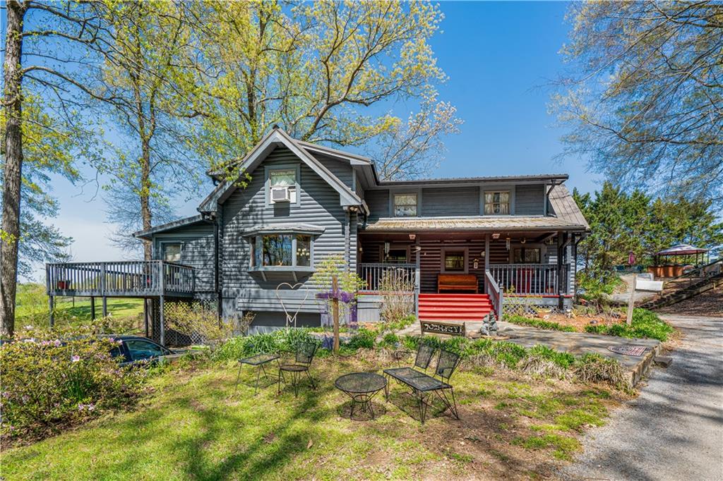 True Log Cabin with a Side Deck and Front Porch!