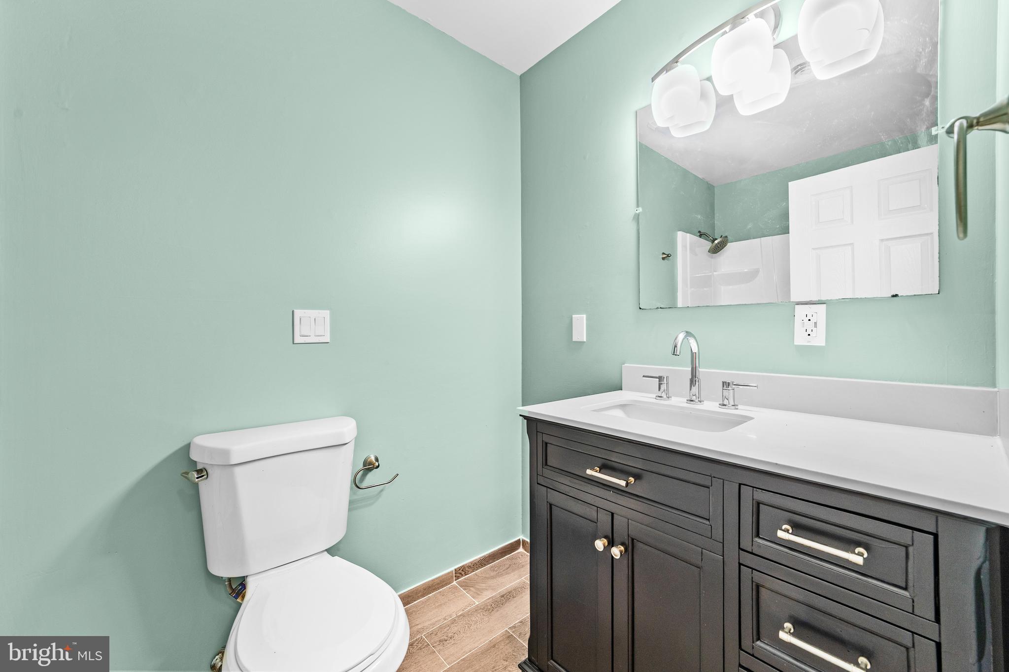 88 Delaware Drive Pennsville, NJ 08070 - Photo 16 of 26 a bathroom with a toilet sink and mirror