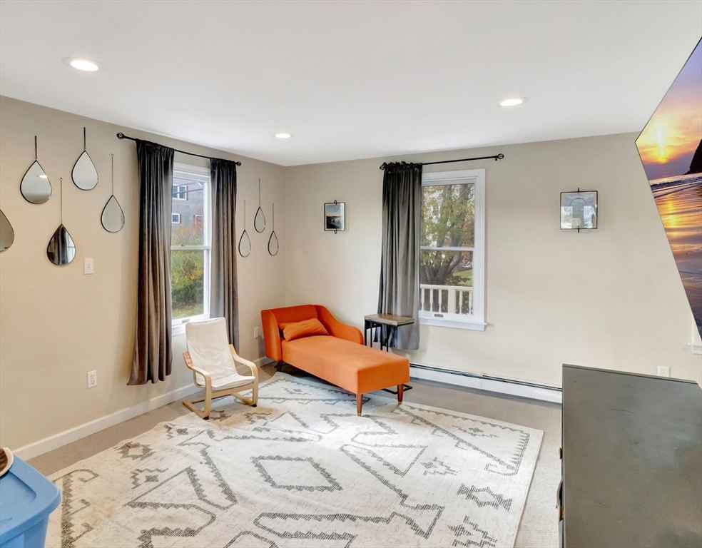 54 Salisbury Street Hull, MA 02045 - Photo 13 of 38 a living room with a couch and a window