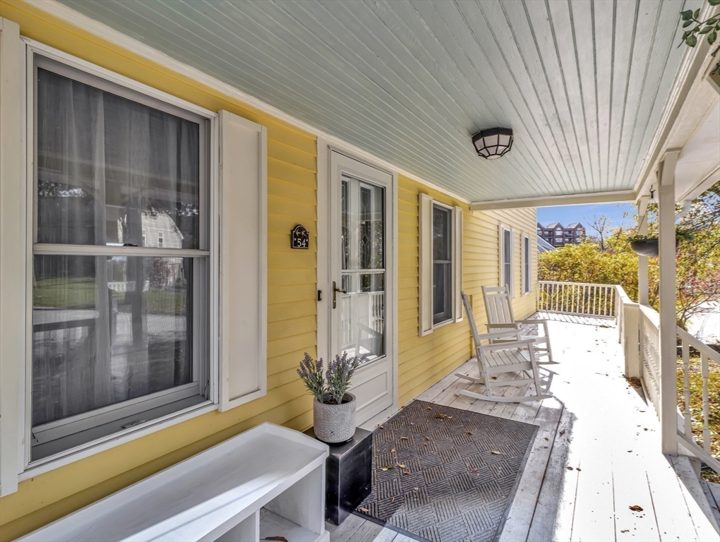 54 Salisbury Street Hull, MA 02045 - Photo 2 of 38 a front view of a house with outdoor seating