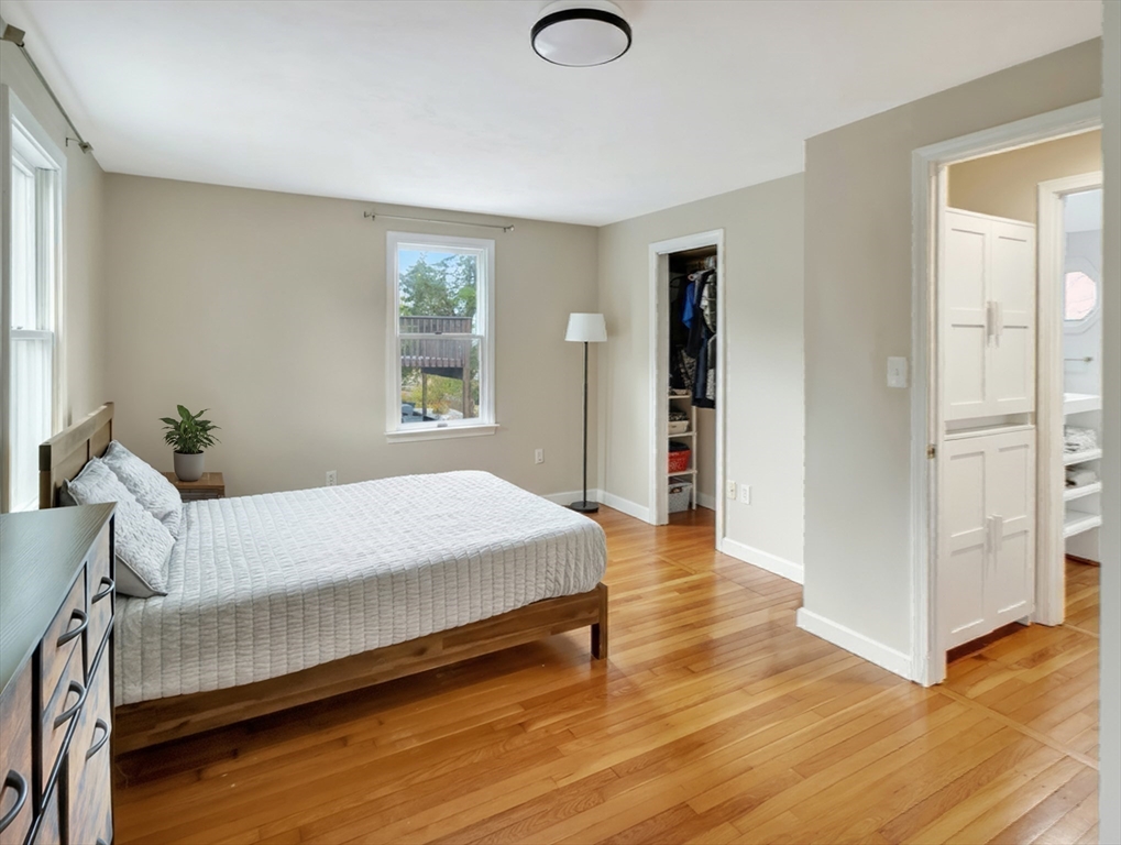 54 Salisbury Street Hull, MA 02045 - Photo 26 of 38 a bedroom with a bed and wooden floor